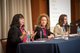 Photo of three female panelists at conference [Image by creator  from ]