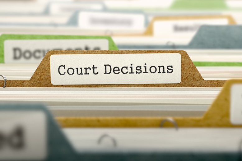 File drawer with one folder in focus, labeled "Court Decisions" [Image by creator tashatuvango from AdobeStock]